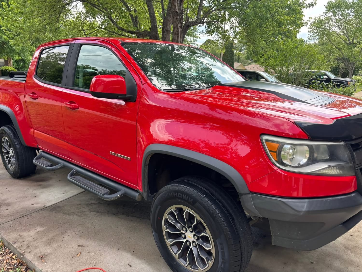 Exterior hand wash on a red Chevy Colorado